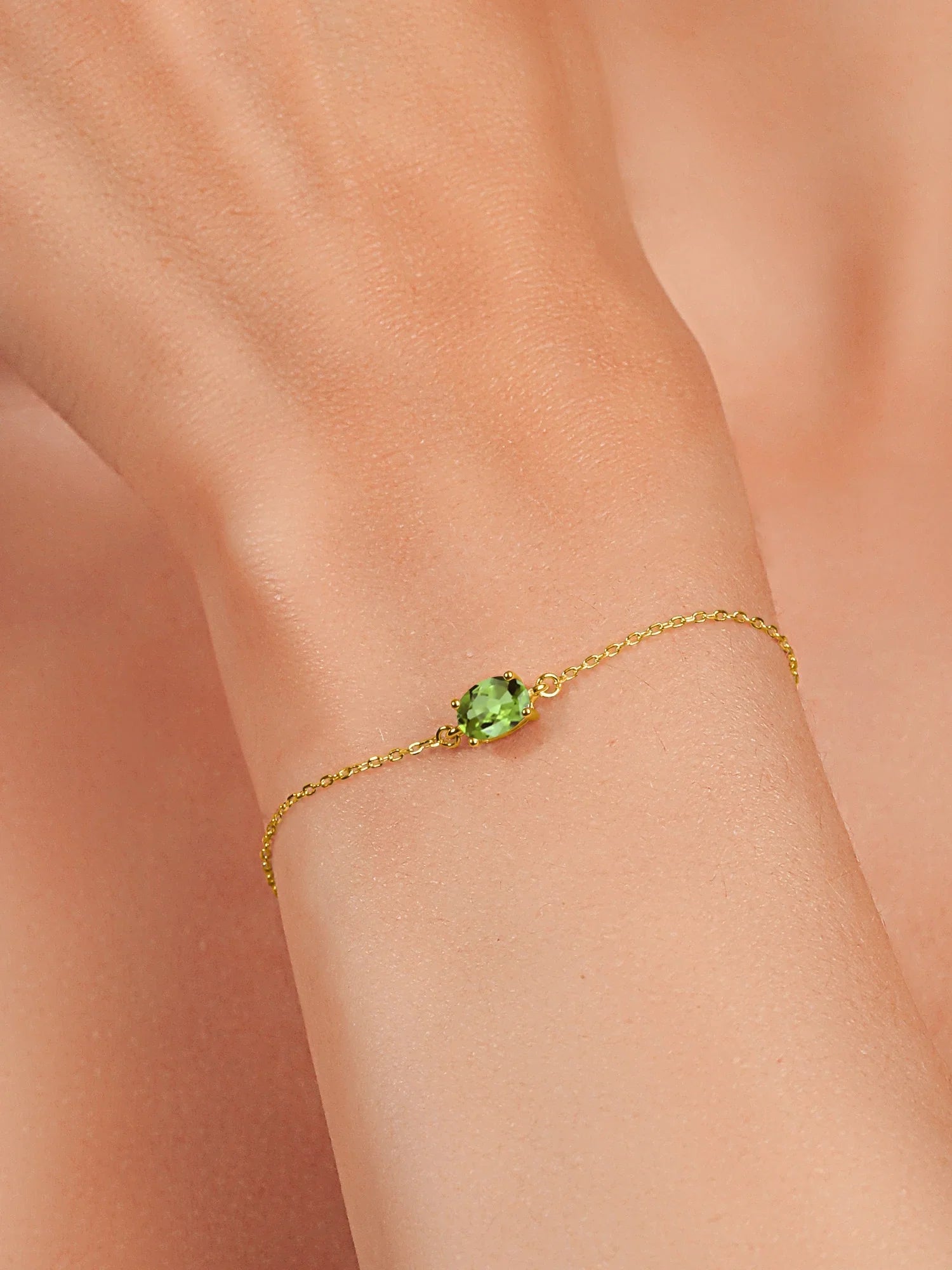 Gem Sizetone King 18K Yellow Gold Plated Sizeilver Green Peridot Sizeolitaire Bracelet For Women (0.90 Cttw, Oval Cut 7x5mm)